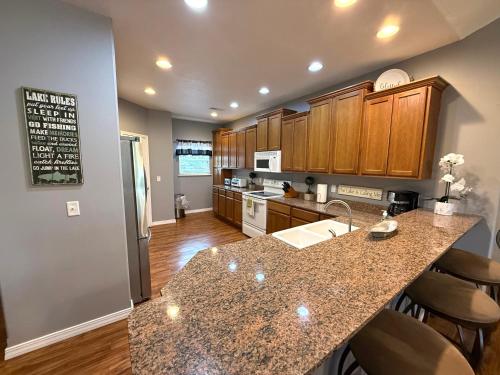 a kitchen with a counter top and a kitchen island at Lakefront and Lake View Condo on Indian Point in Branson