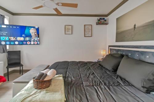 a bedroom with a bed with a person sitting on it at Modern 3BR Condo - Heart of ATL in Atlanta