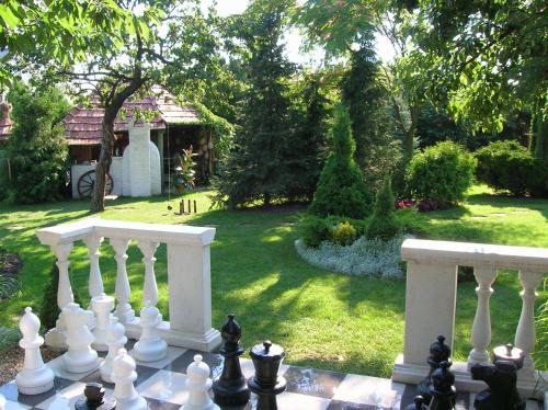 a chess board in front of a yard at Green Park Villa in Eger