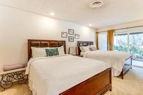 a bedroom with two beds and a window at 2 Mi to Galleta Meadows Desert Golf Retreat! in Borrego Springs