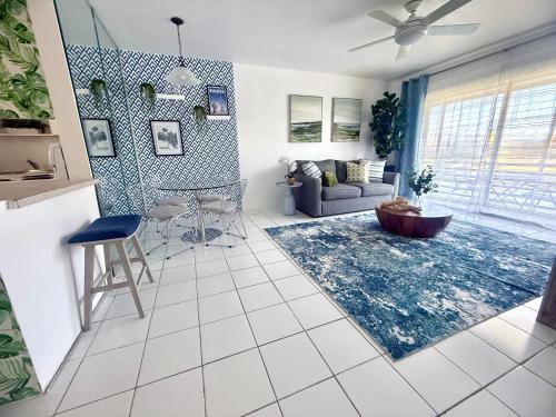 a living room with a couch and a table at Designer's 1 BR 1BA Condo 1 Block to Aventura Mall in Aventura
