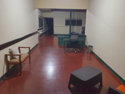a hallway with chairs and a table in a room at SAM TRAVEL LEON in León