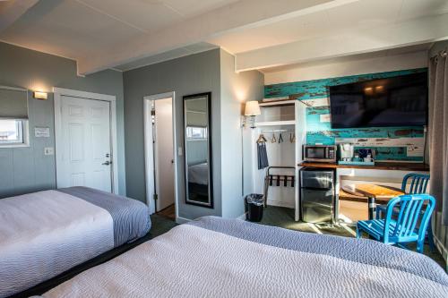 Ένα ή περισσότερα κρεβάτια σε δωμάτιο στο Beachfront Inn