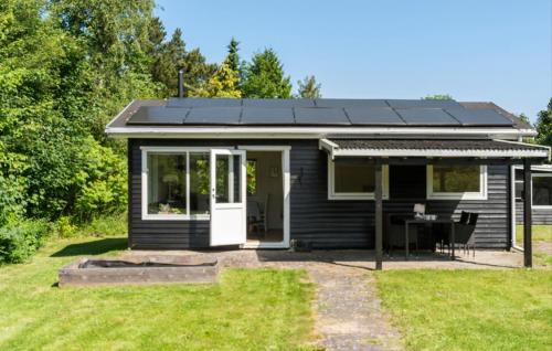 a house with solar panels on the roof at Gorgeous Home In Eskebjerg With Private Swimming Pool, Can Be Inside Or Outside in Eskebjerg