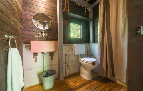 a bathroom with a toilet and a mirror at Nocellara in Alia
