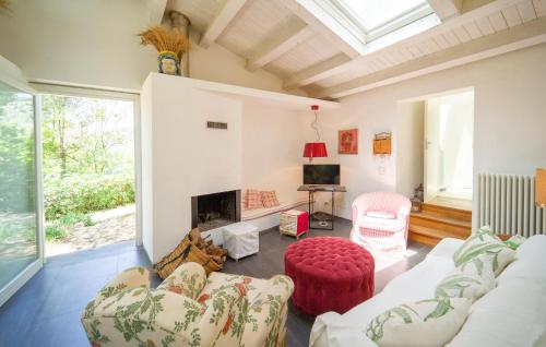 a living room with a couch and a fireplace at Nocellara in Alia