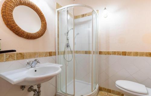 a bathroom with a sink and a shower at Lorenzo in Acqualoreto