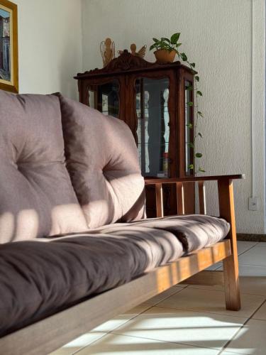 a couch sitting in a living room with a table at Hotel Brasil Real in Guaíba