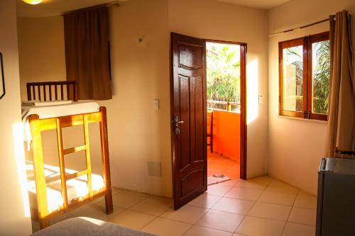 Ένα ή περισσότερα κρεβάτια σε δωμάτιο στο Pousada Casa do Jardim