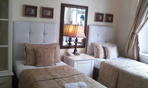 Cama o camas de una habitación en Piccolino Hyde Park Hotel