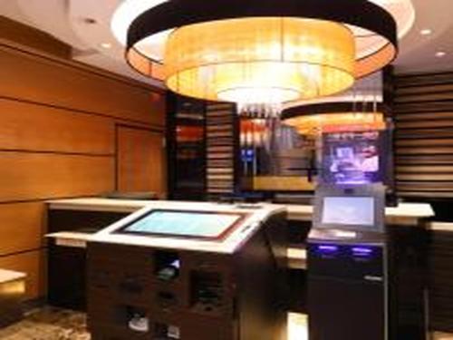 a lobby with a cash register and a light at APA Hotel Mita Ekimae in Tokyo