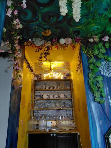 a display case with flowers on the ceiling at CranaSanctuary in Buncrana