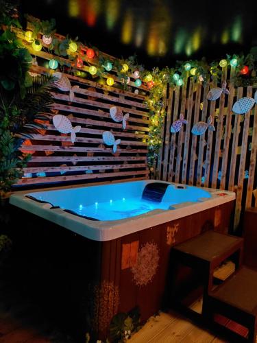 a jacuzzi tub in a room with lights at CranaSanctuary in Buncrana