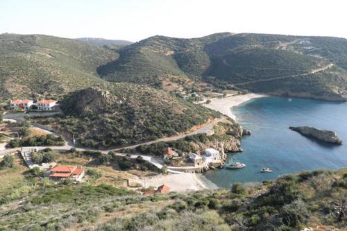 a view of a beach with boats in the water at villapetramarina in Tsakaíoi