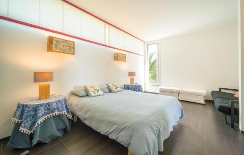 a bedroom with a bed and a table and a window at Cerasuola in Alia