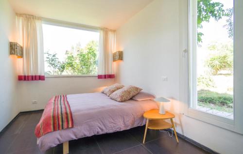 a bedroom with a bed and a large window at Cerasuola in Alia