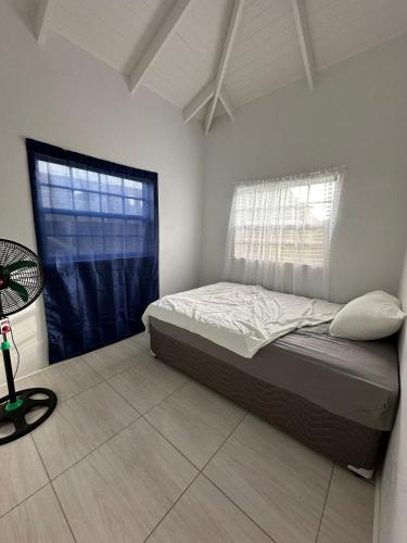 Postel nebo postele na pokoji v ubytování House Case en Bas Gros Islet