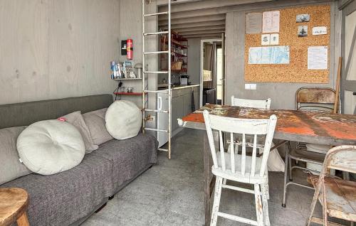 a living room with a couch and a table at 1 Bedroom Gorgeous Home In Vlissingen in Vlissingen