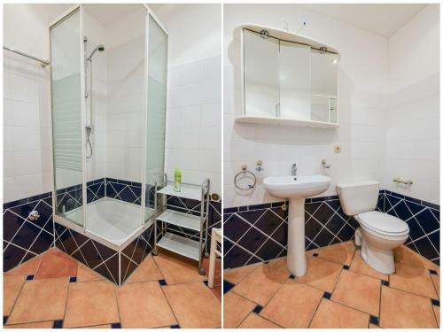 La salle de bains est pourvue d'une douche, de toilettes et d'un lavabo. dans l'établissement Ground floor apartment with terrace near the beach, cleaning included, au Pouldu