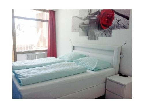 a bed in a room with a window at Schluchseestube 3309 in Schluchsee