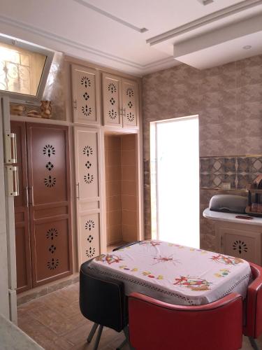 a room with a bed in the corner of a room at 1 Sweet & Spacious House in Hammamet tunisia in Hammamet