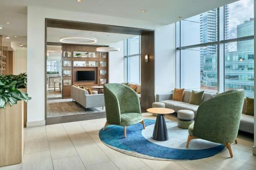 a living room with two chairs and a couch at Element by Westin Vancouver Metrotown in Burnaby