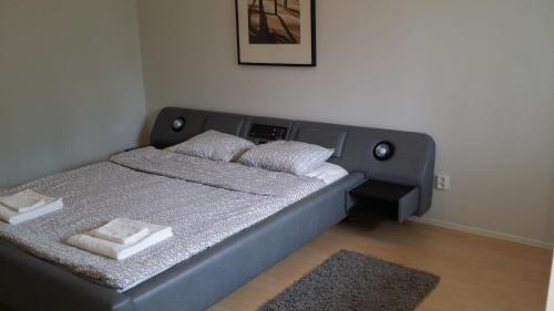Кровать или кровати в номере Nasta Apartment
