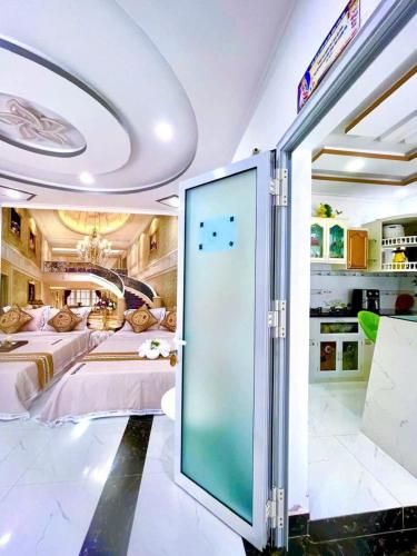 a room with a bed and a sliding glass door at Hoàng Nga Apartment Phan Thiết in Phan Thiet