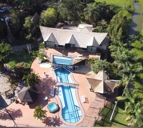 an aerial view of the house with a swimming pool at Fazenda JB in Sete Lagoas