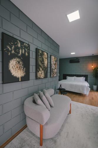 a living room with a couch and a bed at Blockhaus in Rancho Queimado