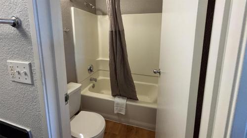 a small bathroom with a toilet and a bath tub at Las Vegas, NV - Boulder Highway in Las Vegas