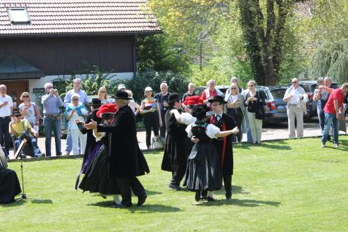 a group of people dressed in historical costumes dancing at Landhotel Hirschen in Oberwolfach