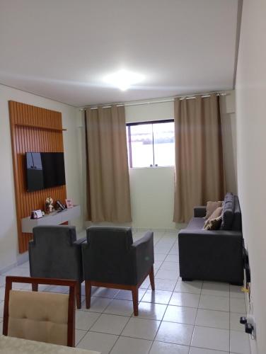 Μια τηλεόραση ή/και κέντρο ψυχαγωγίας στο Apartamento próximo ao parque do povo