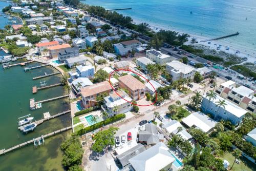 an aerial view of a resort next to the water at Hibiscus Hideaway Condo Walk To Historic Bridge St in Bradenton Beach