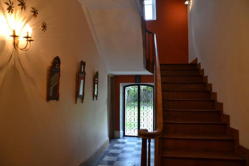 a staircase in a house with a glass door at Mère Elvira in Lourdes