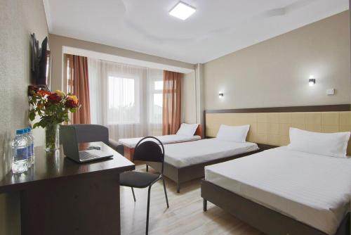 Ένα ή περισσότερα κρεβάτια σε δωμάτιο στο Altamira Hotel
