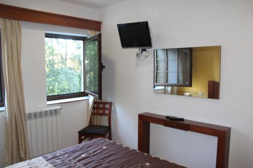 Postel nebo postele na pokoji v ubytování Pála dos Mouros
