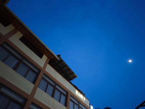 a building with a blue sky in the background at Jiuzhaigou Mountain villa in Jiuzhaigou