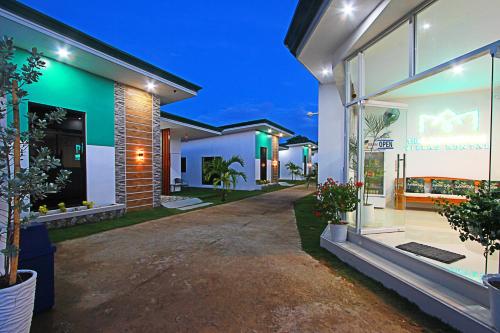 a row of houses at night with lights at the Landing Villas rental in Panglao