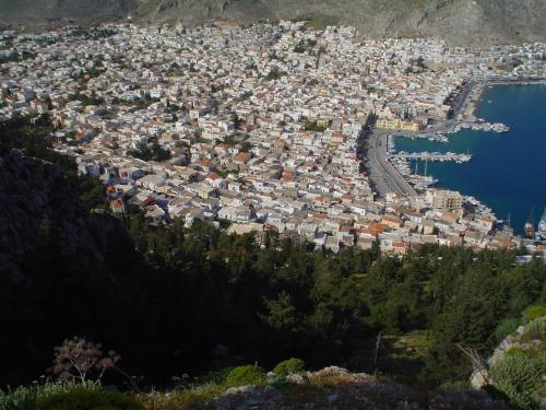 an aerial view of a city with a harbor at Alkyonis Apartments in Panormos Kalymnos