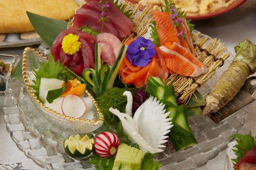 a plate of food with different types of sushi at Almont Hotel Sendai in Sendai