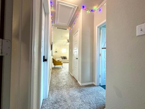 a hallway with christmas lights on the ceilings in a house at Green Meadow Homestay in San Antonio
