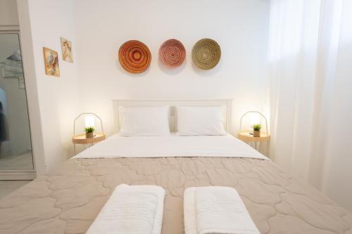 Ένα ή περισσότερα κρεβάτια σε δωμάτιο στο Angie by the sea