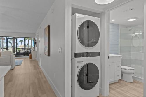 a white bathroom with two dryers in a wall at Pointe Santo C1 in Sanibel