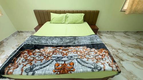 Hotel Prisha Recidencyにあるベッド
