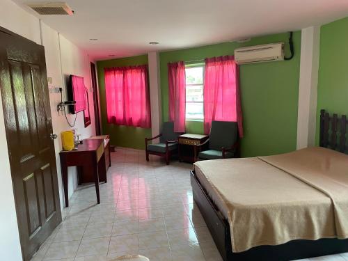 Postel nebo postele na pokoji v ubytování Hotel Medan Kidd