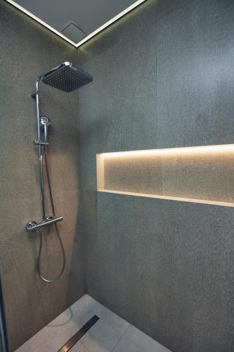 a bathroom with a shower with a shower head at RIO Hotel in Samarkand