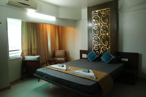 Cama o camas de una habitación en Siddharth Lake View Penthouse