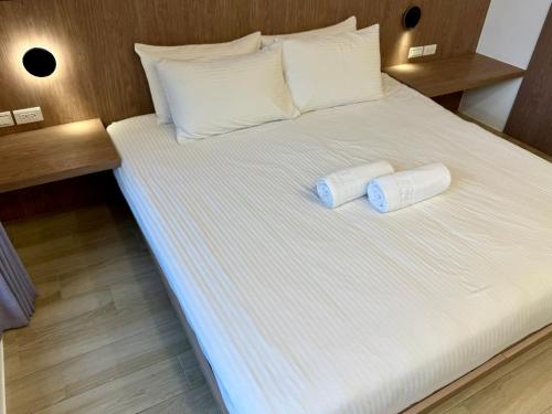Postel nebo postele na pokoji v ubytování 柔意琉居 Zoy Liuqiu Inn
