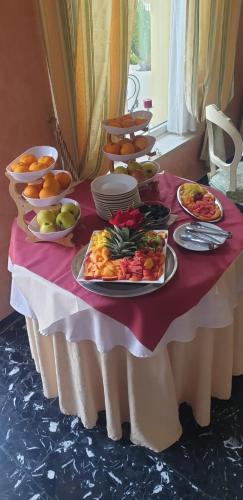 a table with plates of food on top of it at Viktoria Palace Hotel in Venice-Lido